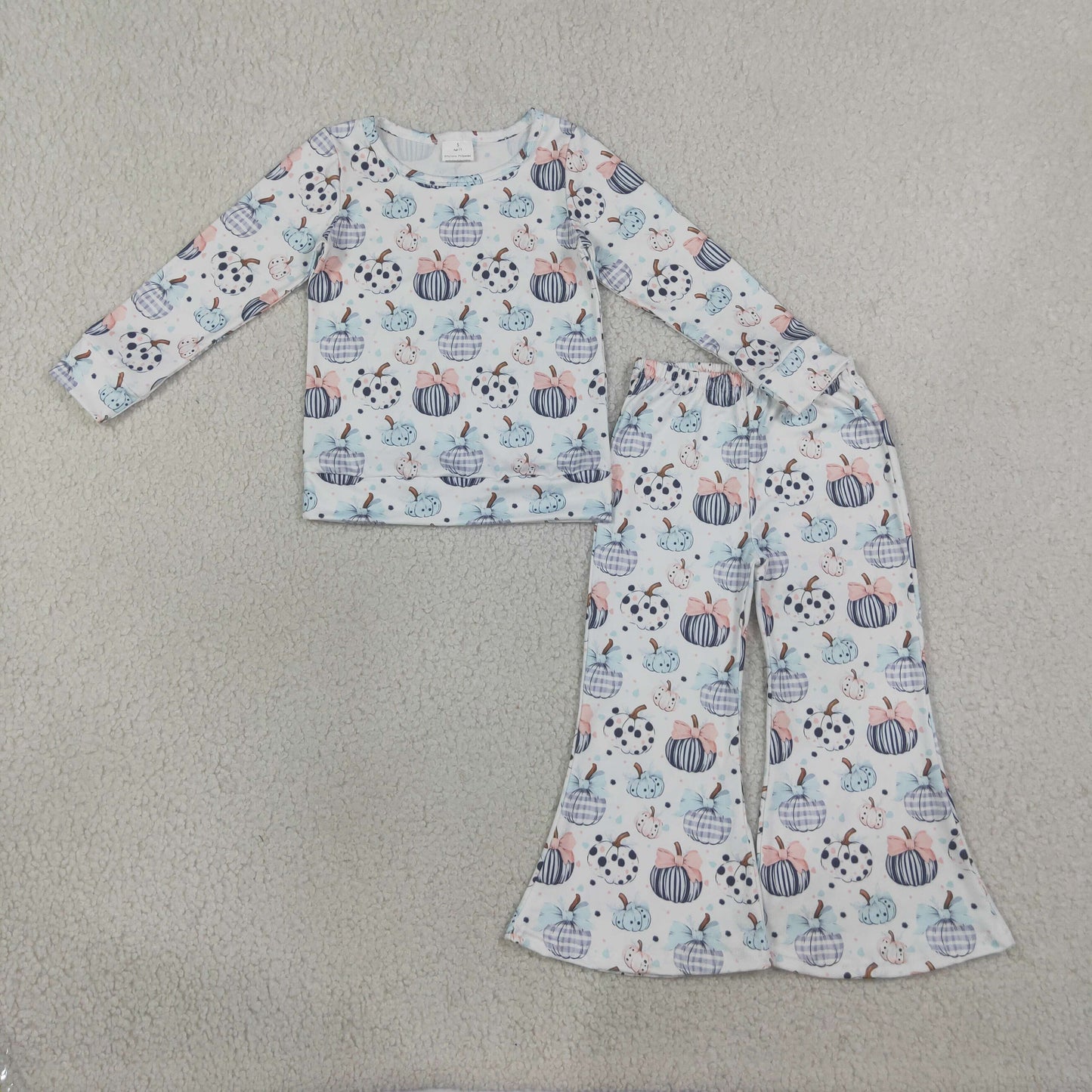 girl pumpkin shirt pants outfit