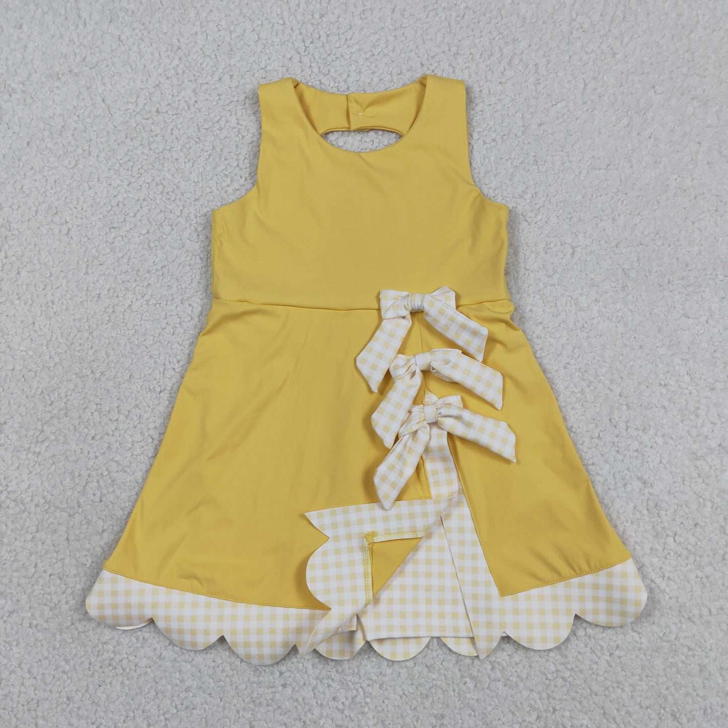 yellow sleeveless athletic scallop dress