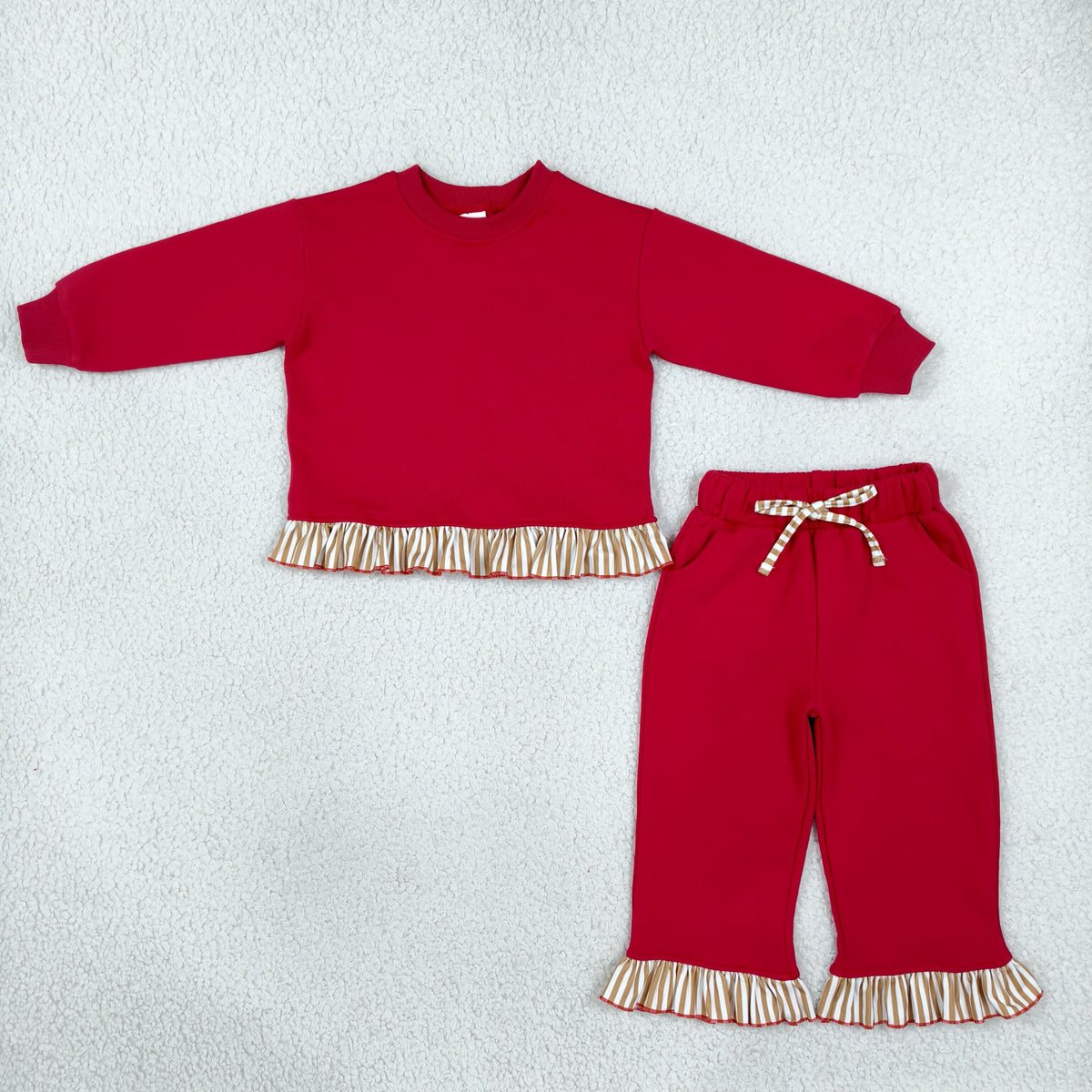 solid red outfit with ruffle striped trim