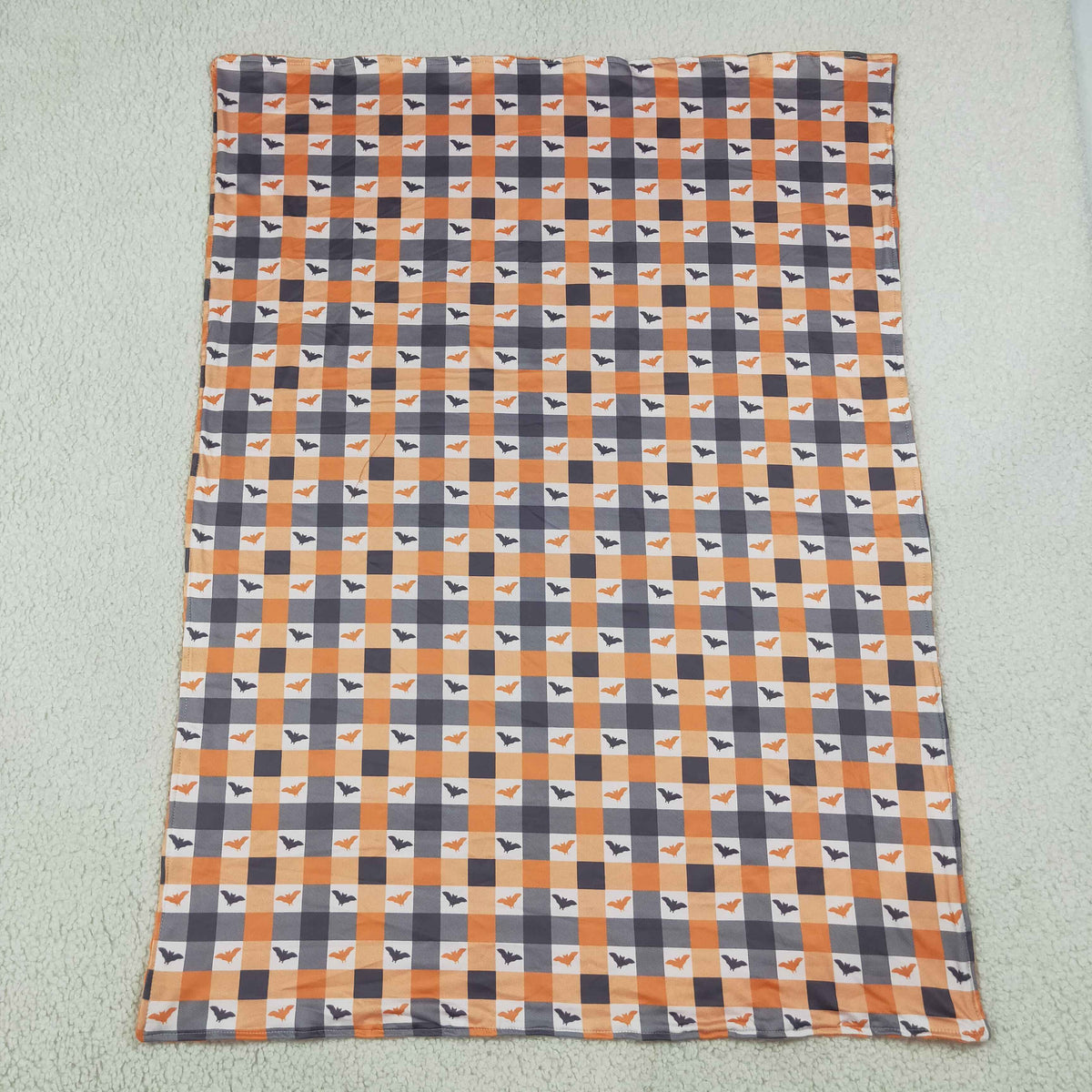 orange checkered with bat baby blanket