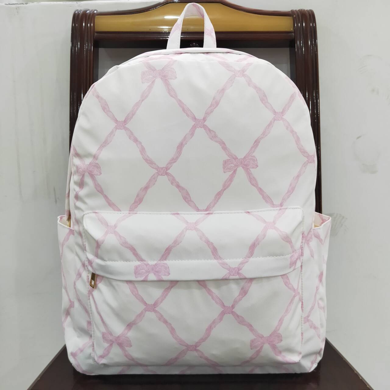 BA0225 Pink and white backpack with bow pattern  D 3.24