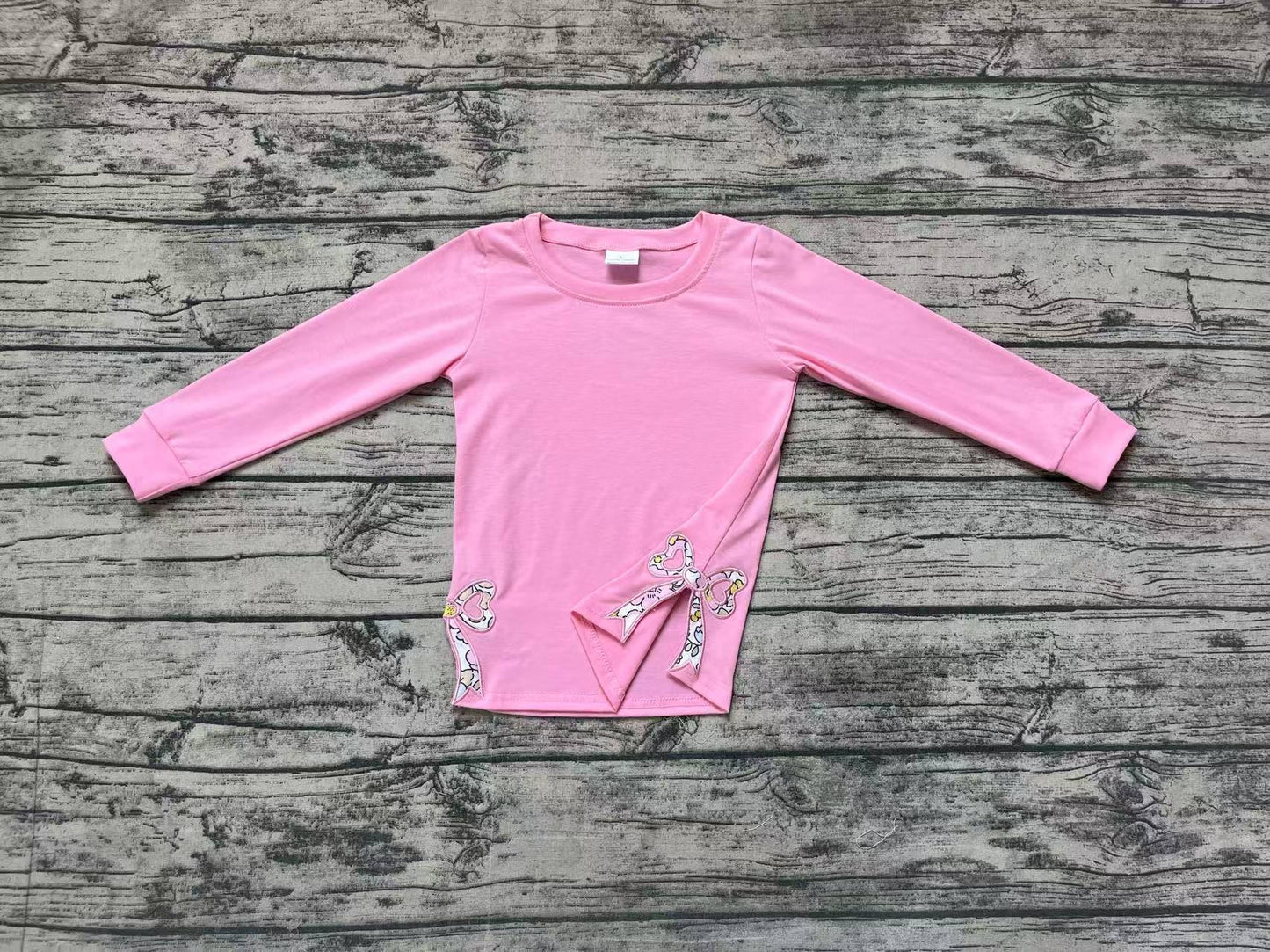 GT0872  Pink long-sleeved top with floral and bow pattern