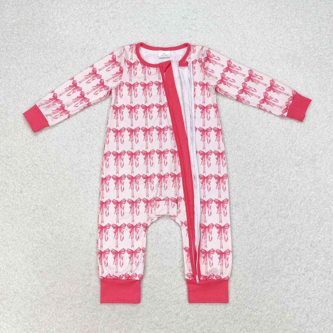 LR1035 Pink and white zippered long-sleeved jumpsuit with bow pattern