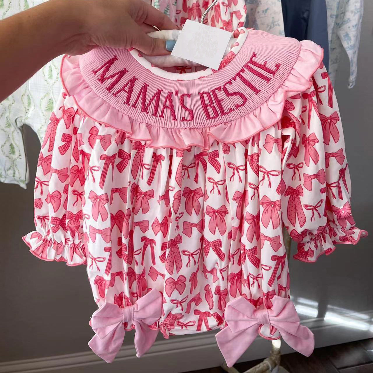 SR2620 Pink and white long-sleeved bodysuit with bow pattern