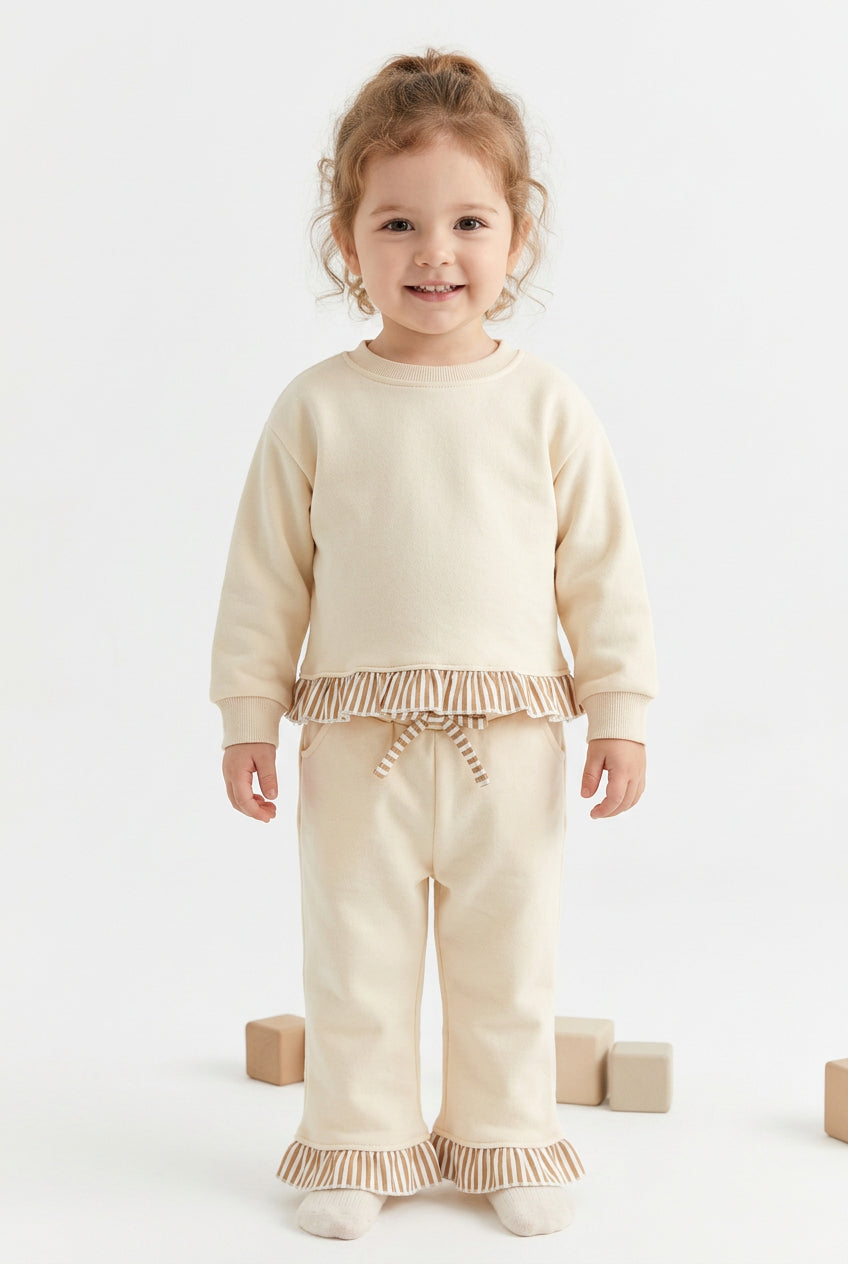 solid off white outfit with ruffle striped trim
