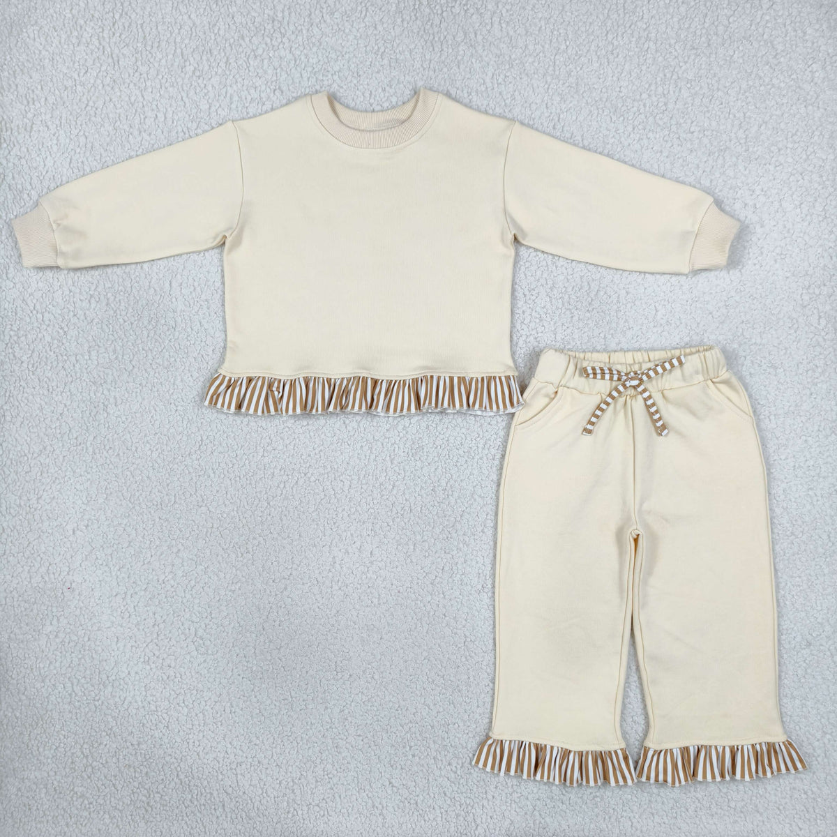 solid off white outfit with ruffle striped trim