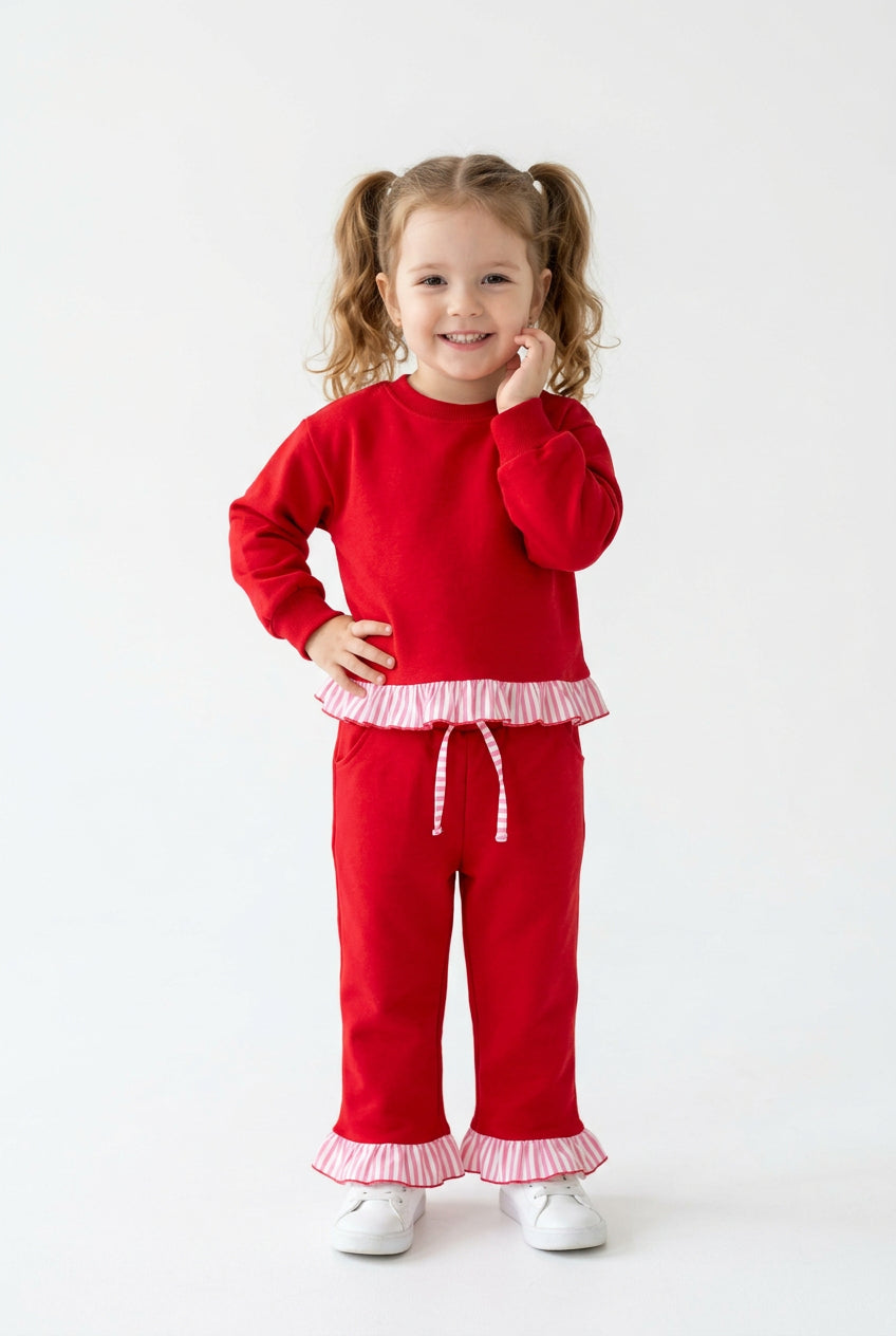 solid red outfit with ruffle striped trim