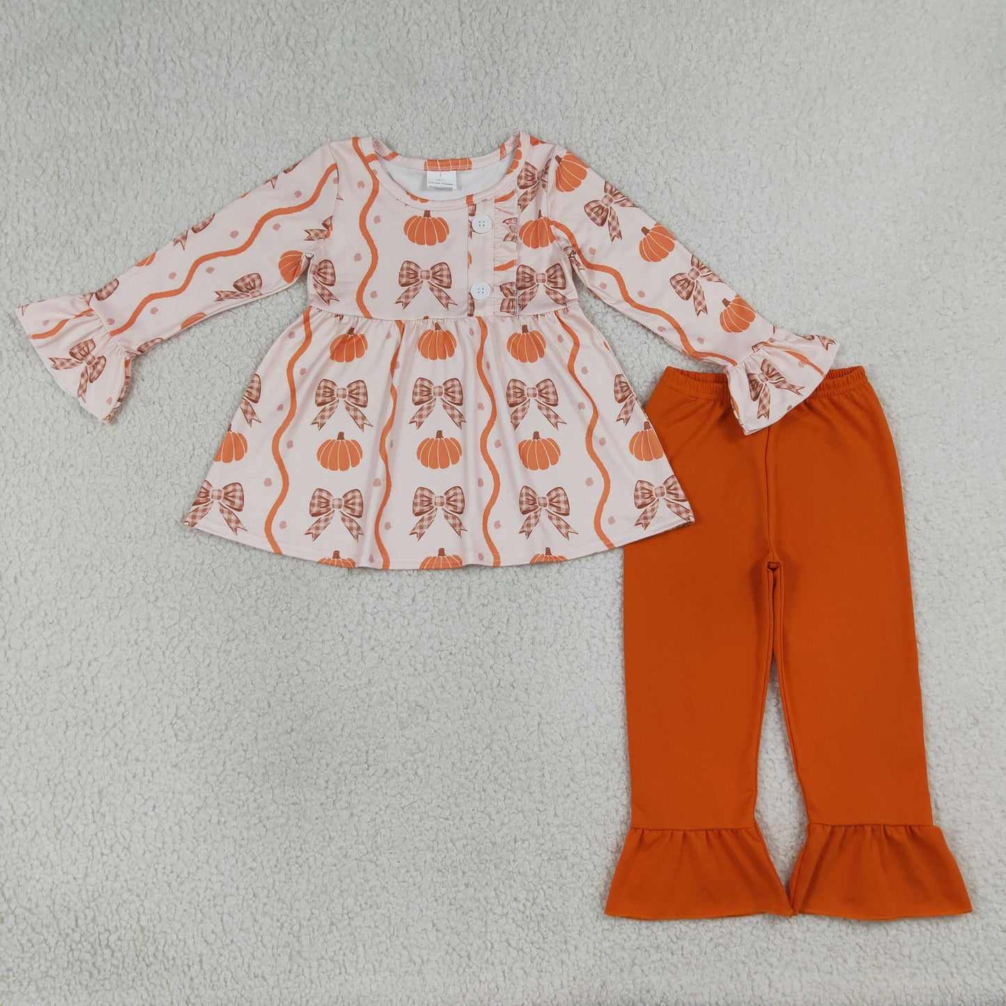orange pumpkin and coquette pants set
